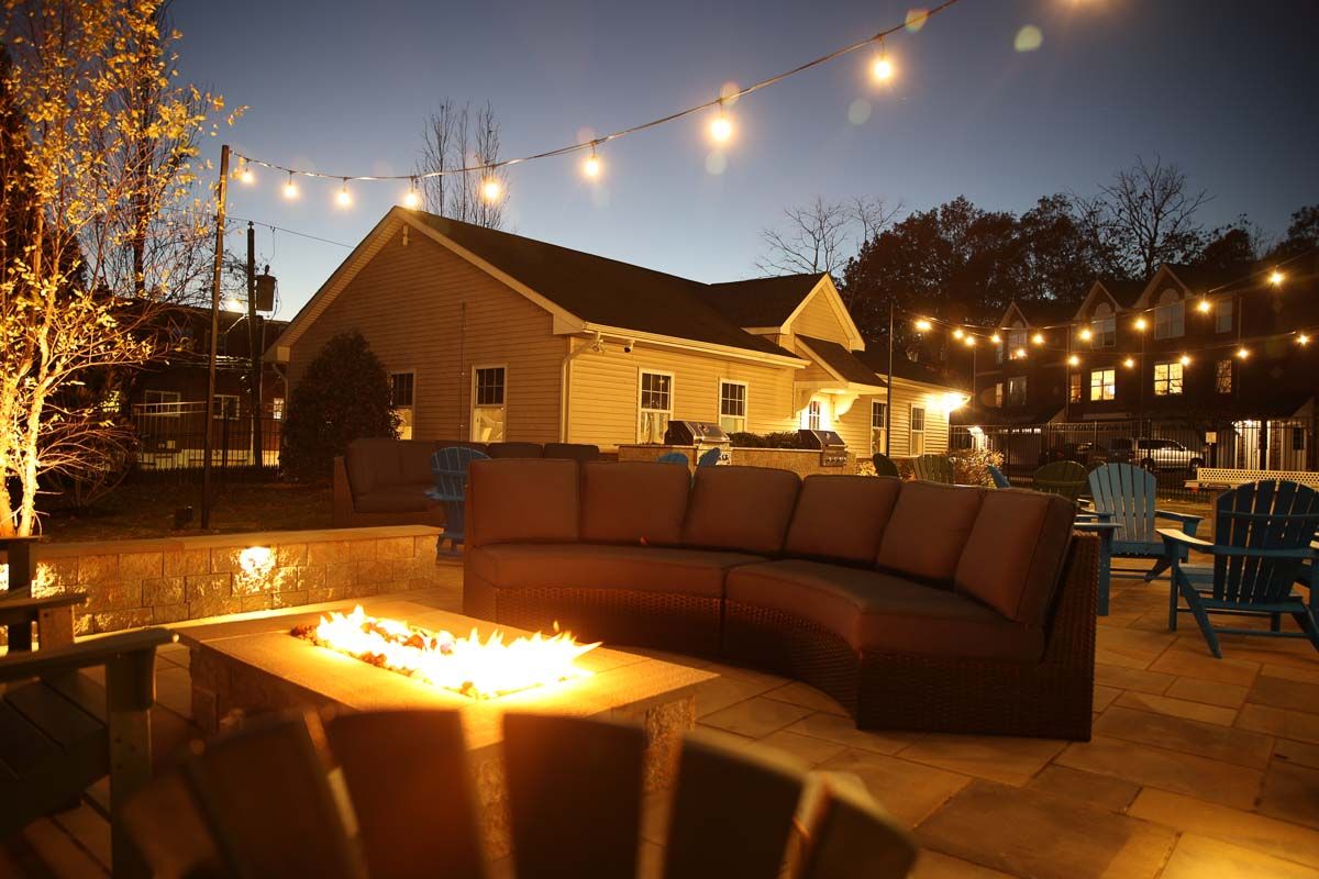 rittenhouse station student apartments newark outdoor fire pit at night